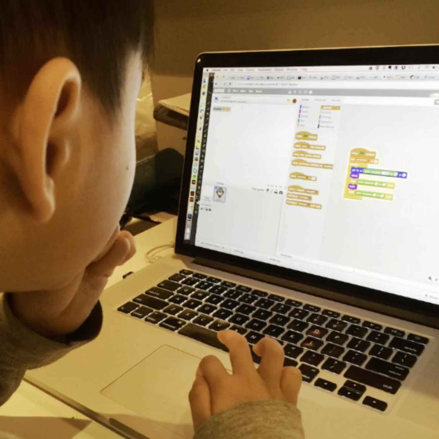 Young Tru learning Scratch