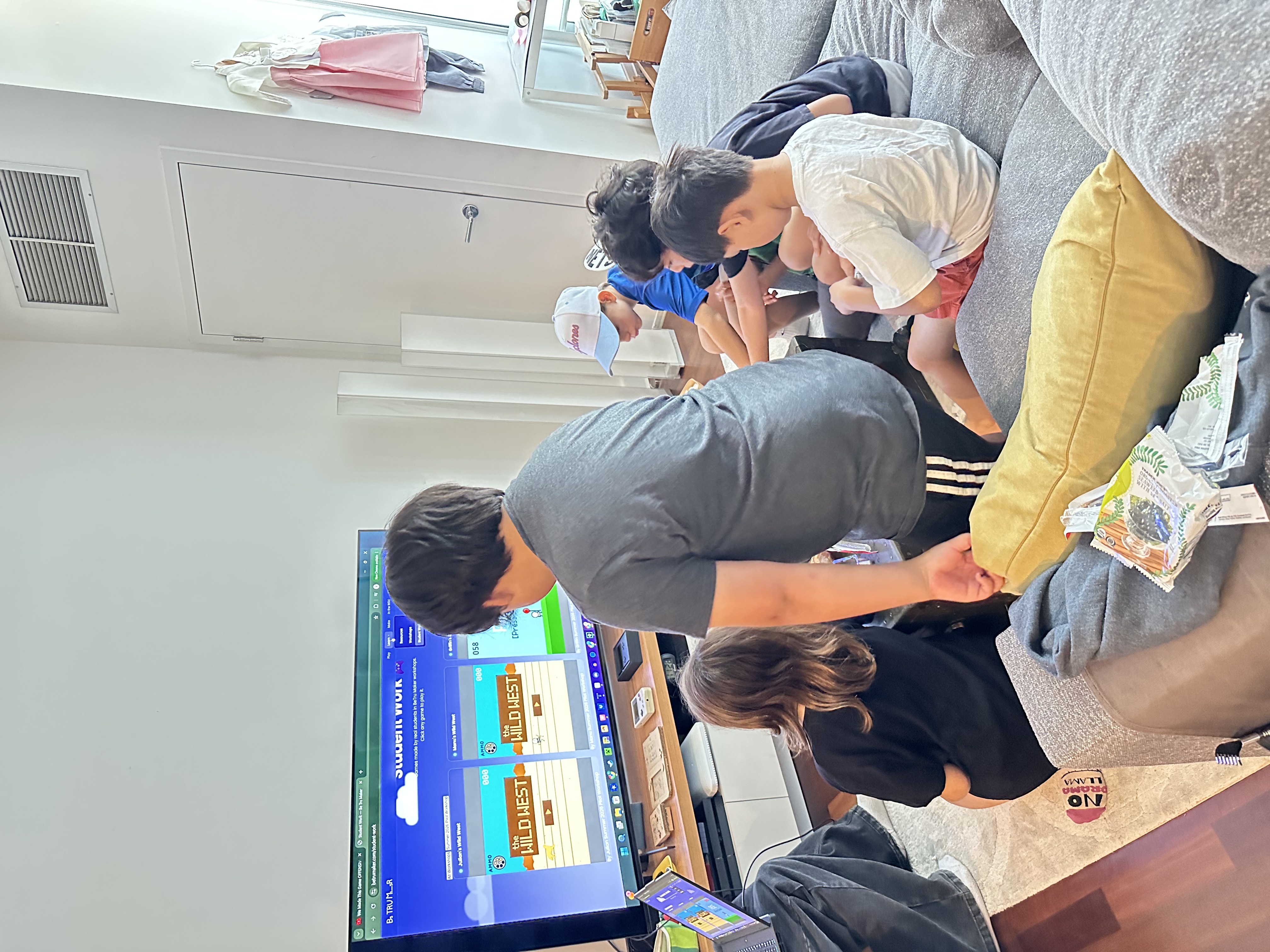 Students watching their games on the TV