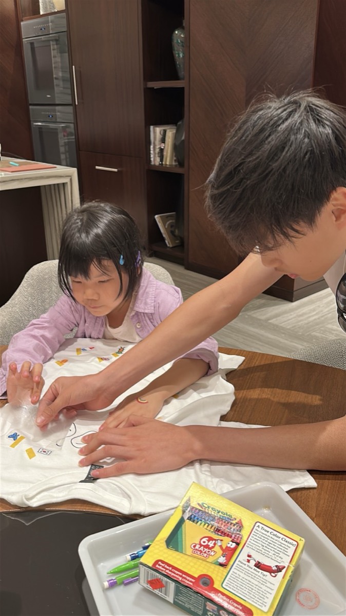 Truman helping a young maker