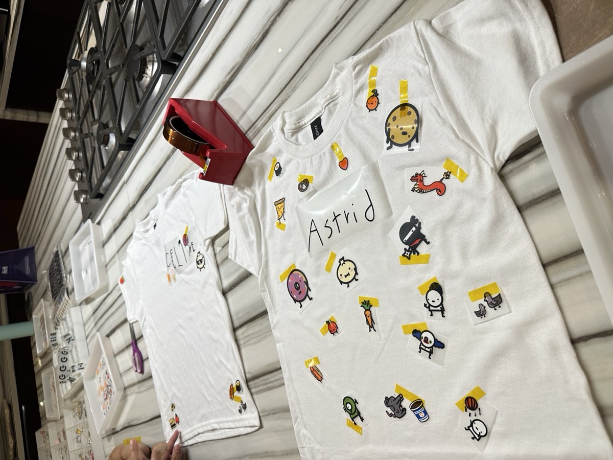Two finished shirt designs, taped and ready