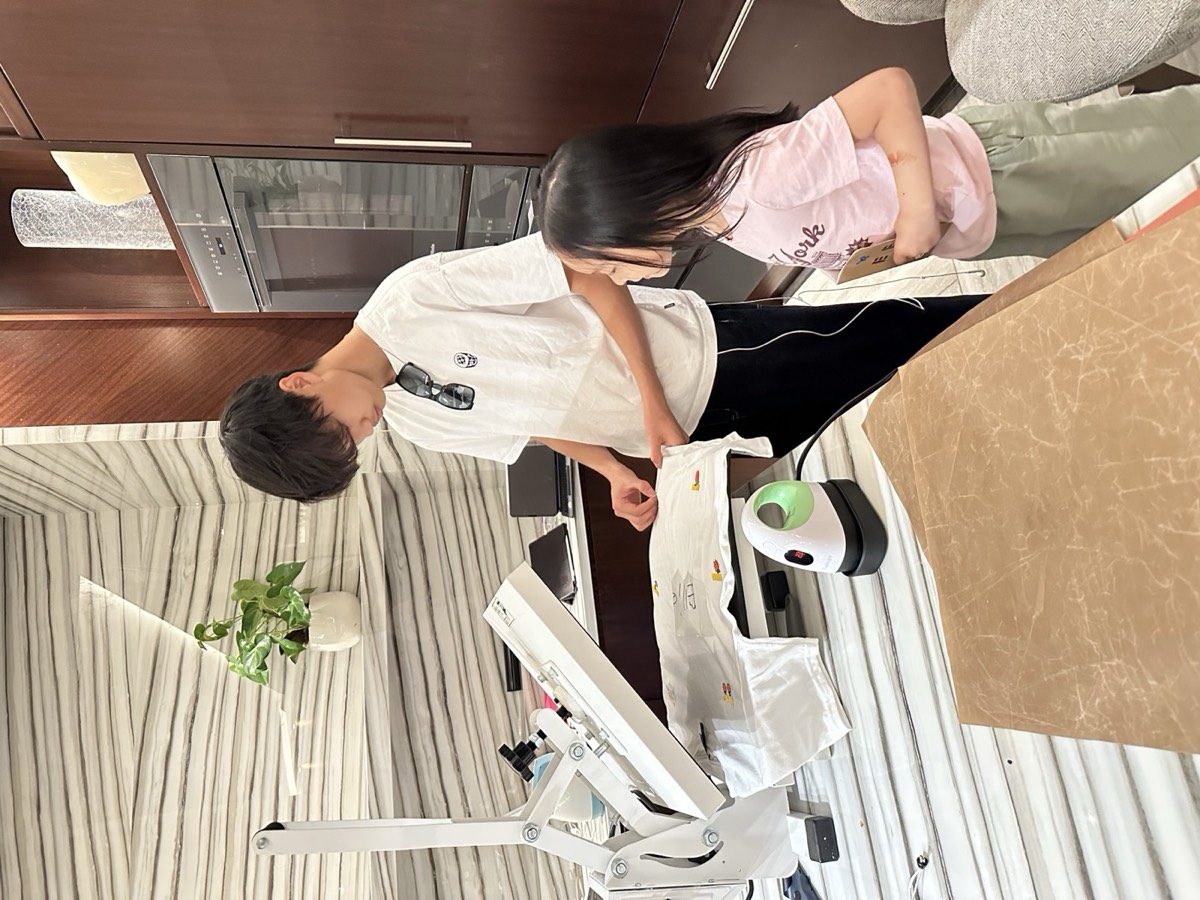 Truman showing a maker her pressed shirt