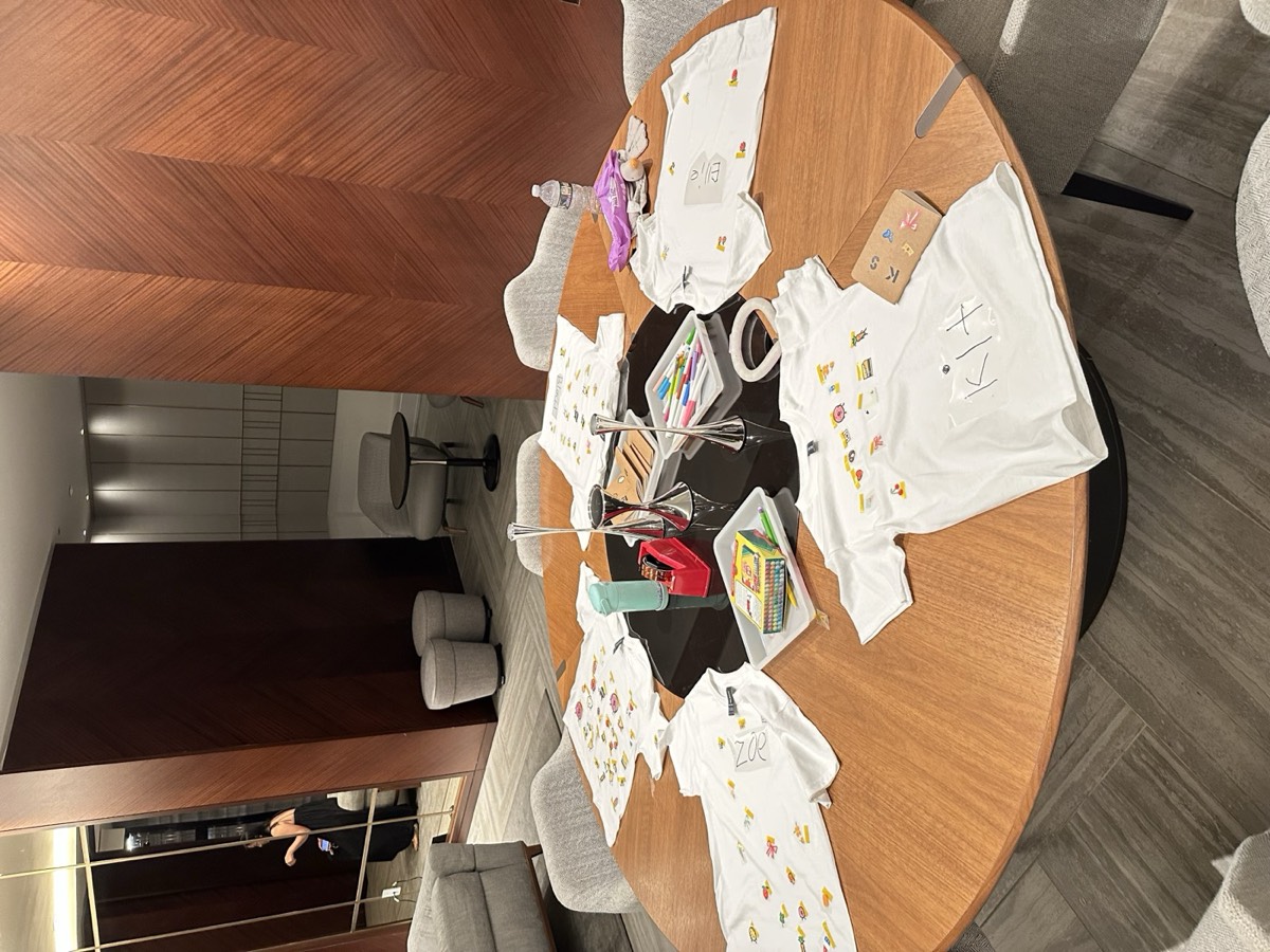 Every shirt laid out around the table