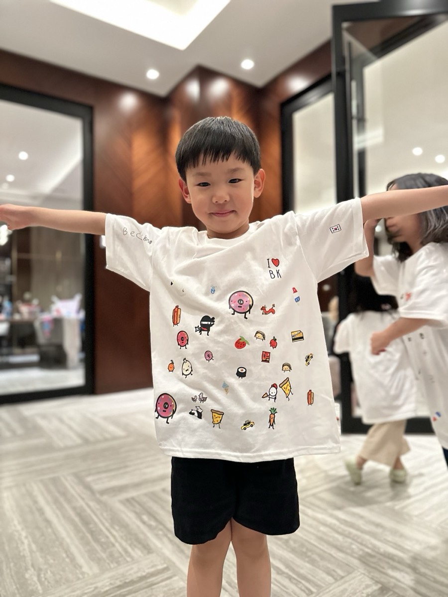 A maker showing off his character-covered shirt